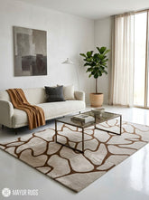 Organic pebble abstract silk and wool hand-tufted area rug featuring irregular cream and beige forms with flowing brown outlines in a neutral modern design by Mayur Rugs.
