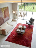 Crimson bloom abstract wool and silk hand-tufted area rug featuring layered cherry red, crimson, burgundy, wine, brown, blush, and beige floral-inspired organic patterns by Mayur Rugs.