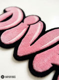 DIVA pink Y2K hand-tufted custom wool rug featuring oversized bubble-style pink lettering with lighter highlights and a bold black outline by Mayur Rugs.
