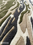Rectangular Sandstorm Camo abstract rug in olive green, beige, charcoal grey, and ivory with a flowing camouflage-inspired pattern by Mayur Rugs.