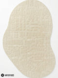Ivory organic loop and cut hand-tufted wool area rug featuring raised abstract textured patterns and an irregular rounded shape for modern neutral interiors by Mayur Rugs.