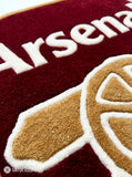 Arsenal hand-tufted custom rug featuring the Arsenal football crest, cannon design, red and blue colors, handmade from premium New Zealand wool by Mayur Rugs.
