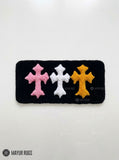 Chrome Hearts inspired cross keyboard rug featuring raised pink, white, and yellow gothic crosses on a black hand-tufted wool desk rug by Mayur Rugs.