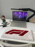 F1 inspired Formula racing hand-tufted keyboard rug featuring a bold red motorsport graphic on a plush white wool base for racing and gaming desk setups by Mayur Rugs.