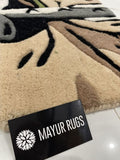 Mayur Rugs rug with a brand card in the foreground Zoro inspired One Piece hand-tufted wool rug with bold anime character design, premium custom area rug by Mayur Rugs