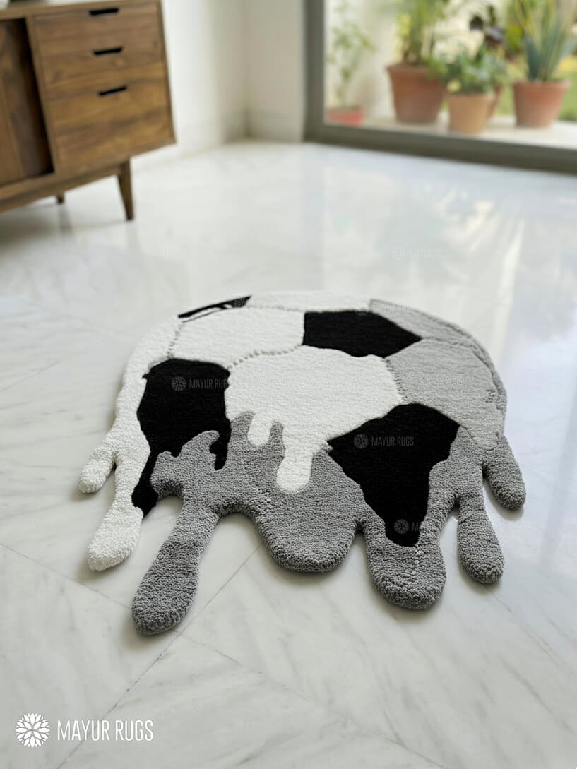 Melting football handmade wool rug with surreal sports art design, modern custom area rug by Mayur Rugs