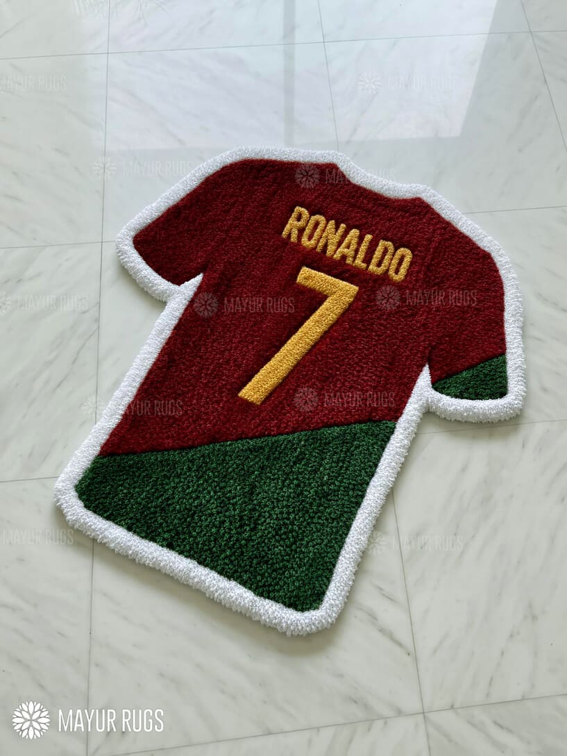 Rug designed like a soccer jersey with 'Ronaldo' and number '7' on a tiled floor.