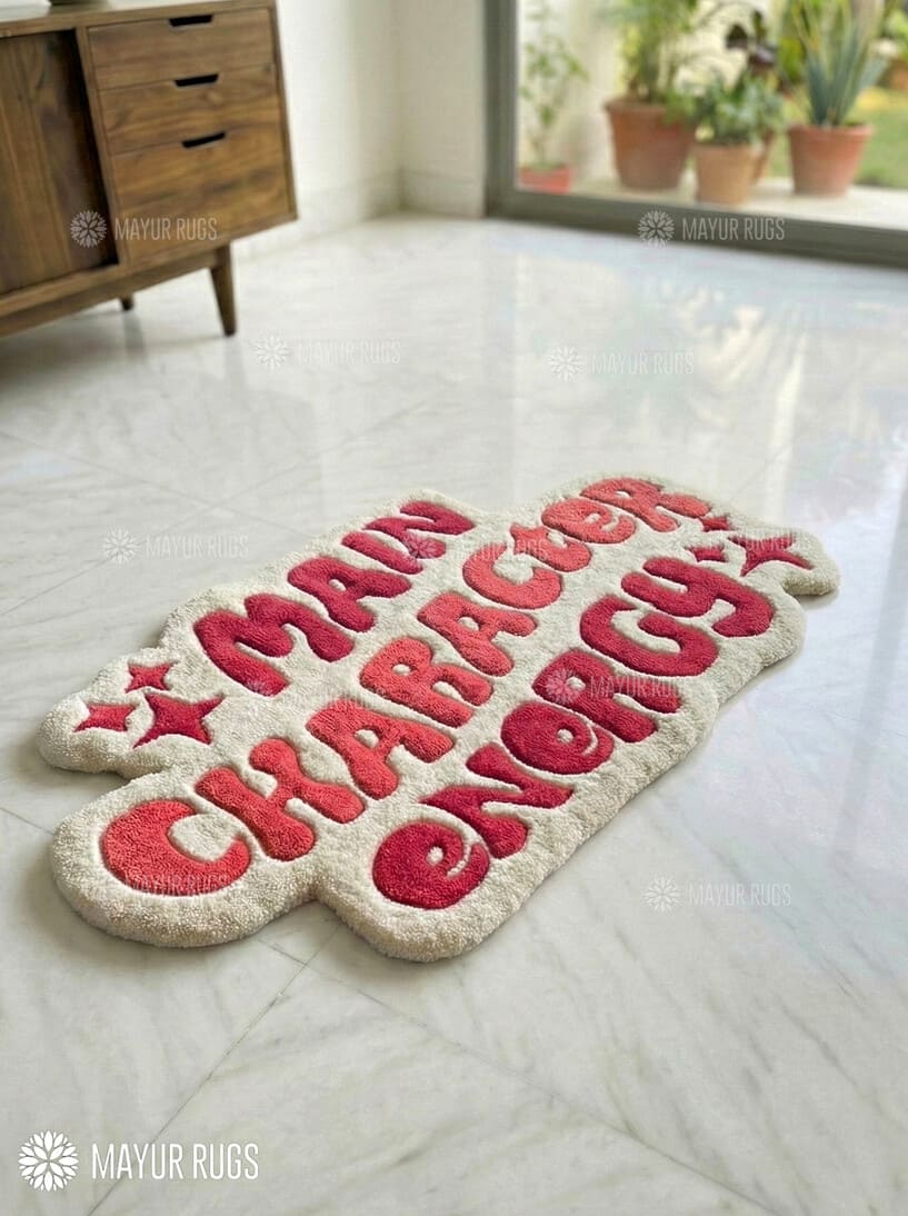 Main character energy handmade wool rug with bold statement typography design, premium custom area rug by Mayur Rugs