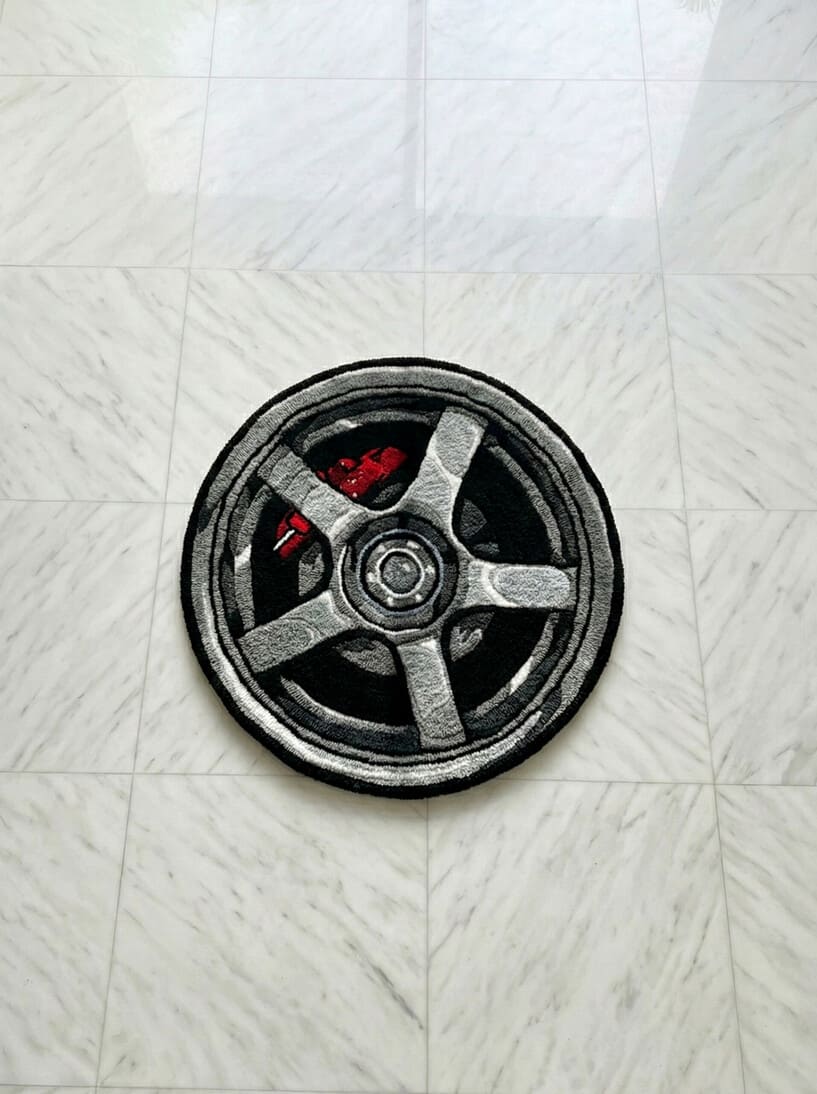 Shop Car Wheel Handmade Rugs by Mayur Rugs. Crafted from premium New Zealand wool with bold automotive design and custom sizing—perfect for car enthusiasts and modern spaces.