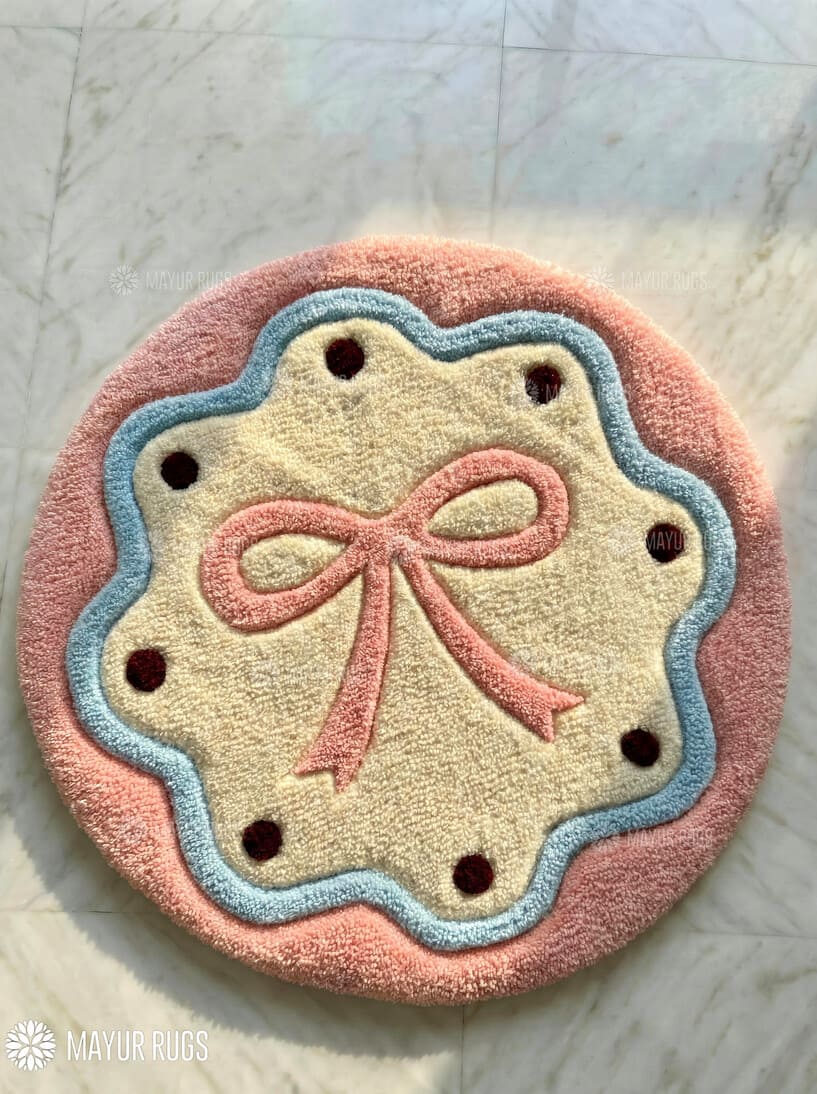 Blush bow cookie hand-tufted wool rug with pastel round design and soft aesthetic details, premium custom area rug by Mayur Rugs