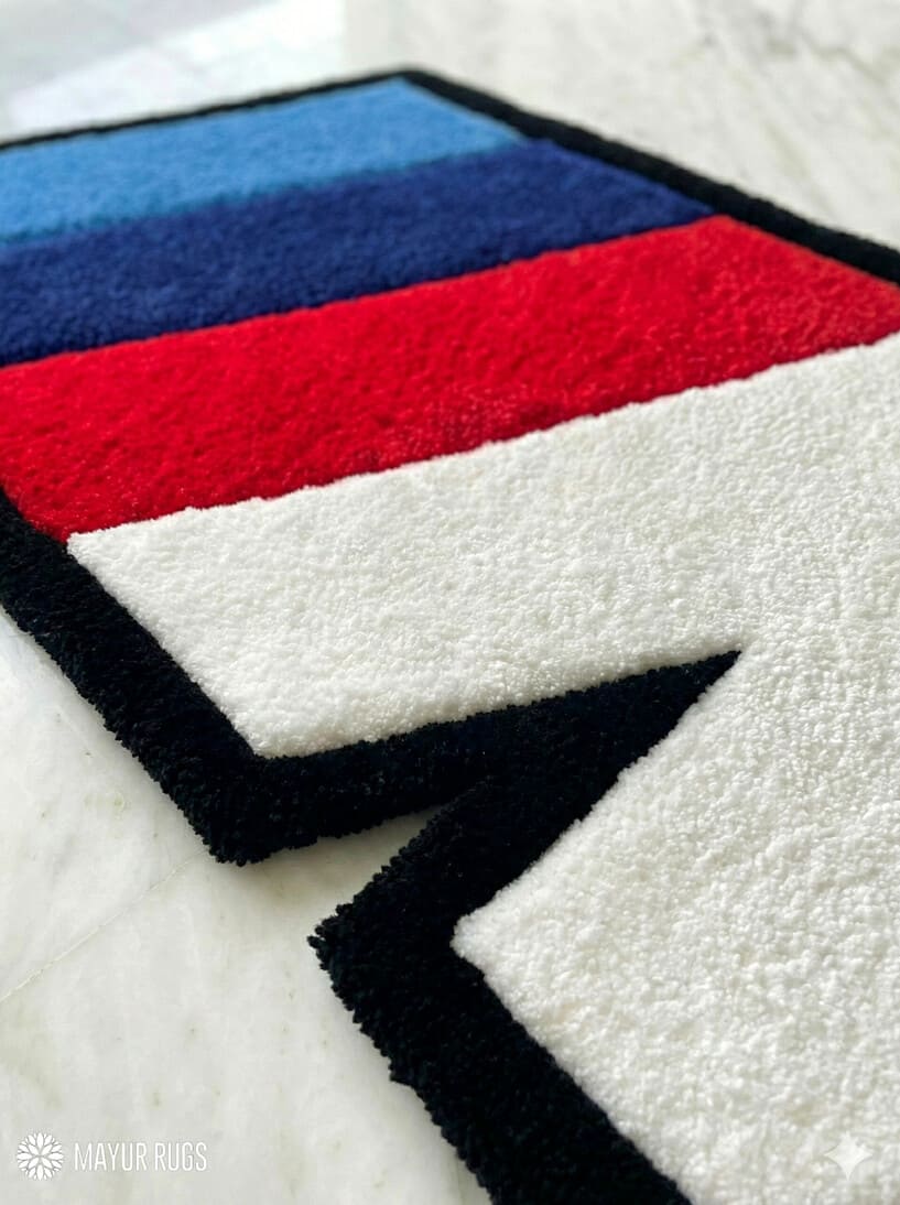 BMW IIM logo inspired hand-tufted wool rug with motorsport automotive design, premium custom area rug by Mayur Rugs
