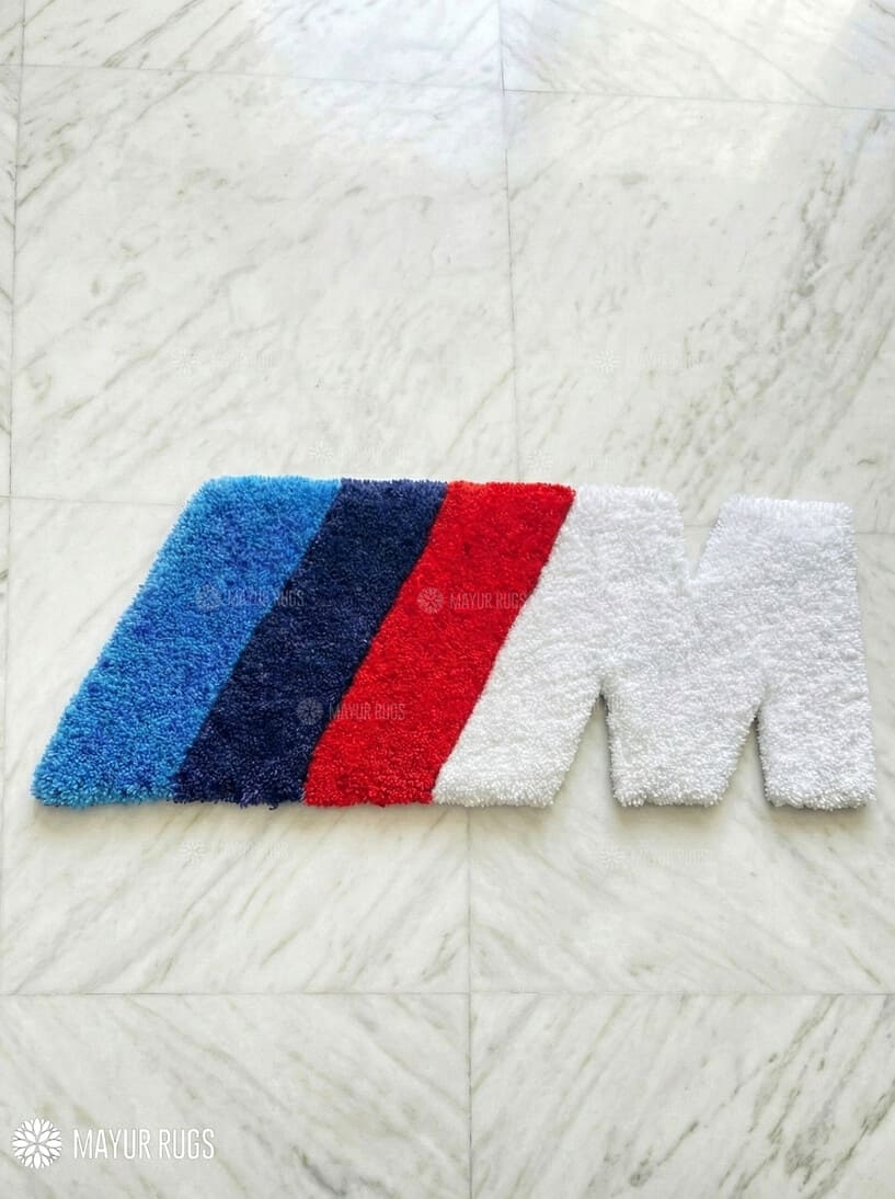 Rectangular rug with blue, red, and white stripes on a textured white surface