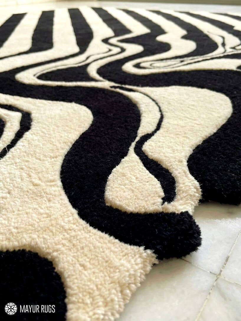 Melting liquid abstract hand-tufted wool rug with drip effect silhouette, premium custom area rug by Mayur Rugs