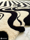 Melting liquid abstract hand-tufted wool rug with drip effect silhouette, premium custom area rug by Mayur Rugs