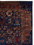 Vintage Persian Heriz hand-knotted wool rug in navy blue with traditional geometric medallion design, premium heritage rug by Mayur Rugs