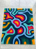 Colorful abstract rug with wavy patterns on a white background