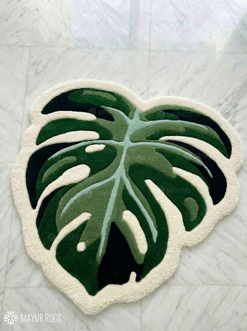 Green monstera leaf hand-tufted wool rug with tropical botanical design, premium custom area rug by Mayur Rugs