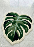 Green monstera leaf hand-tufted wool rug with tropical botanical design, premium custom area rug by Mayur Rugs