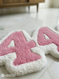 444 aesthetic typography hand-tufted wool rug with pastel pink angel number design by Mayur Rugs