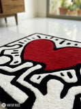 Keith Haring inspired abstract hand-tufted wool rug with pop-art street aesthetic design by Mayur Rugs