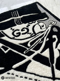 High-top sneaker hand-tufted wool rug featuring monochrome streetwear-inspired footwear artwork by Mayur Rugs