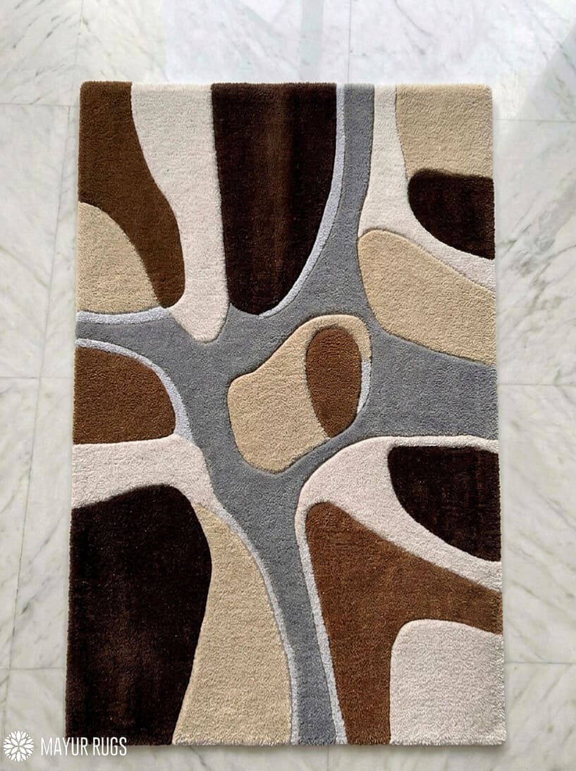 Earth tone abstract hand-tufted wool rug featuring organic modern shapes in brown, beige, ivory, and grey by Mayur Rugs