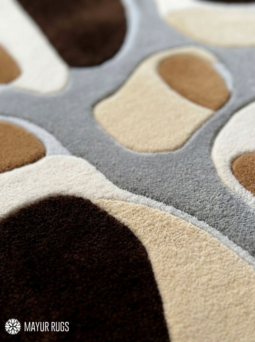 Earth tone abstract hand-tufted wool rug featuring organic modern shapes in brown, beige, ivory, and grey by Mayur Rugs
