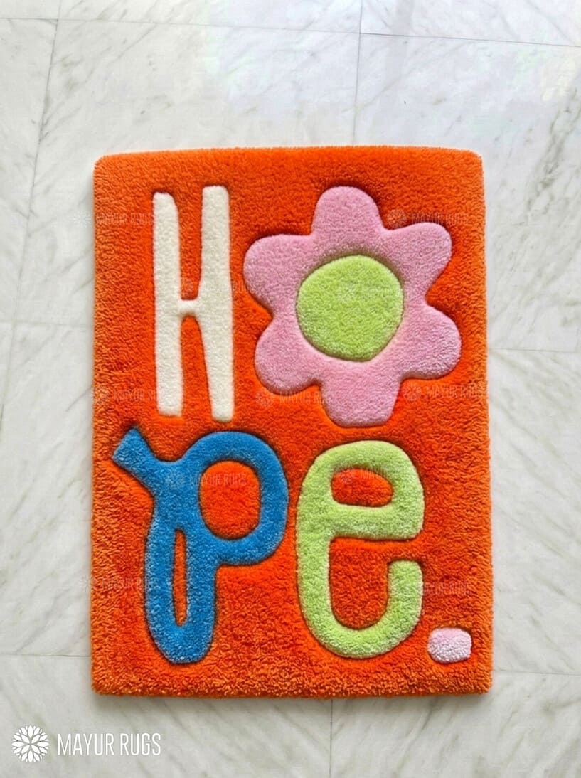 HOPE typography hand-tufted wool rug with minimalist inspirational aesthetic design by Mayur Rugs