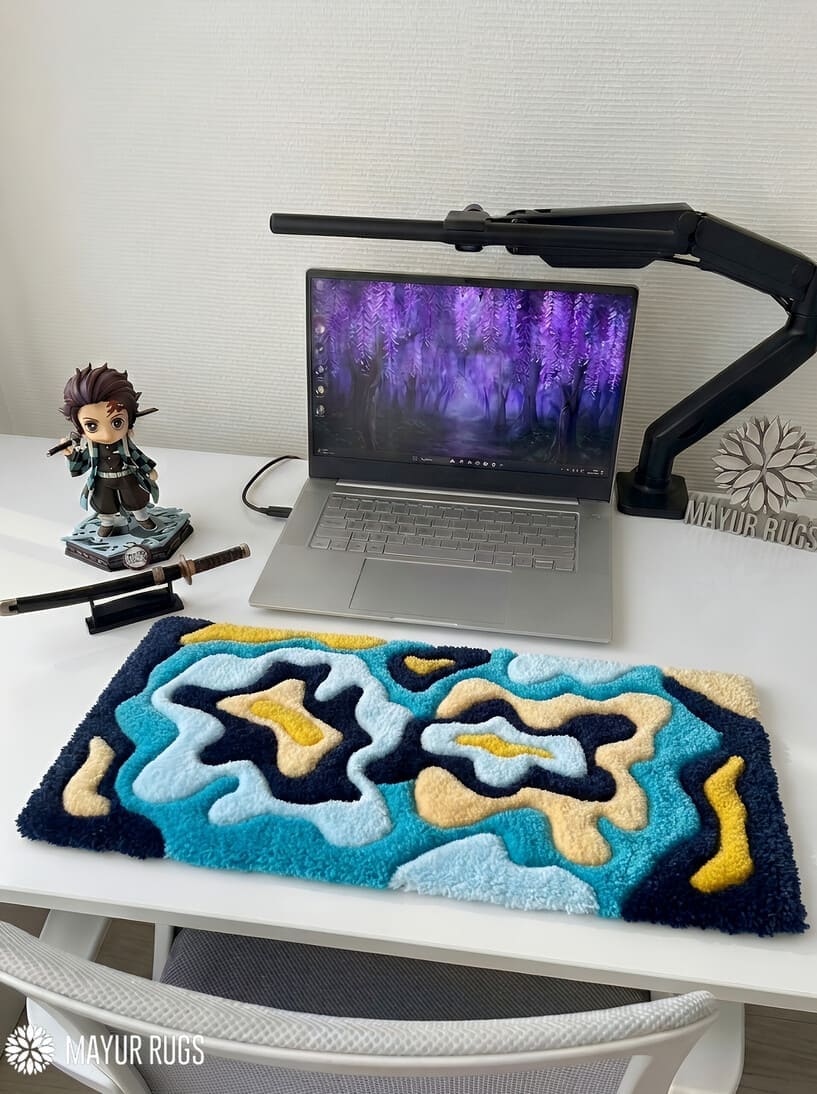 Ocean-inspired abstract hand-tufted keyboard rug featuring layered blue and cream flowing artwork for desk setups by Mayur Rugs
