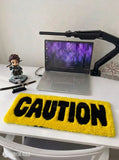 Caution typography hand-tufted wool rug with yellow and black industrial statement design by Mayur Rugs