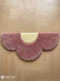 Blush pink cloud-shaped hand tufted keyboard rug with minimalist aesthetic design by Mayur Rugs