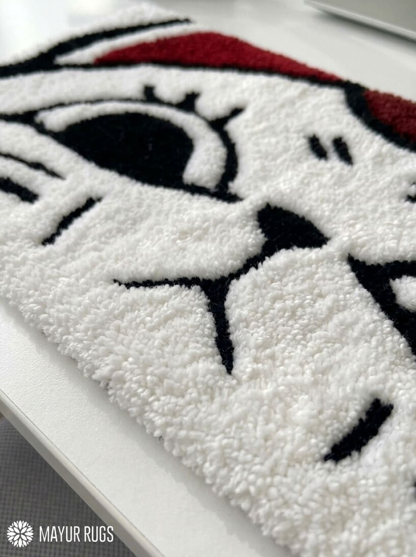 Sleepy cartoon cat face hand tufted keyboard rug with kawaii aesthetic by Mayur Rugs