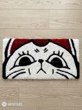 Sleepy cartoon cat face hand tufted keyboard rug with kawaii aesthetic by Mayur Rugs