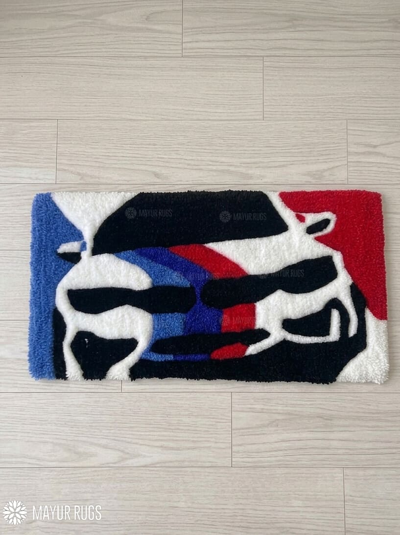 BMW M Inspired hand-tufted keyboard rug with luxury automotive gaming desk setup aesthetic by Mayur Rugs