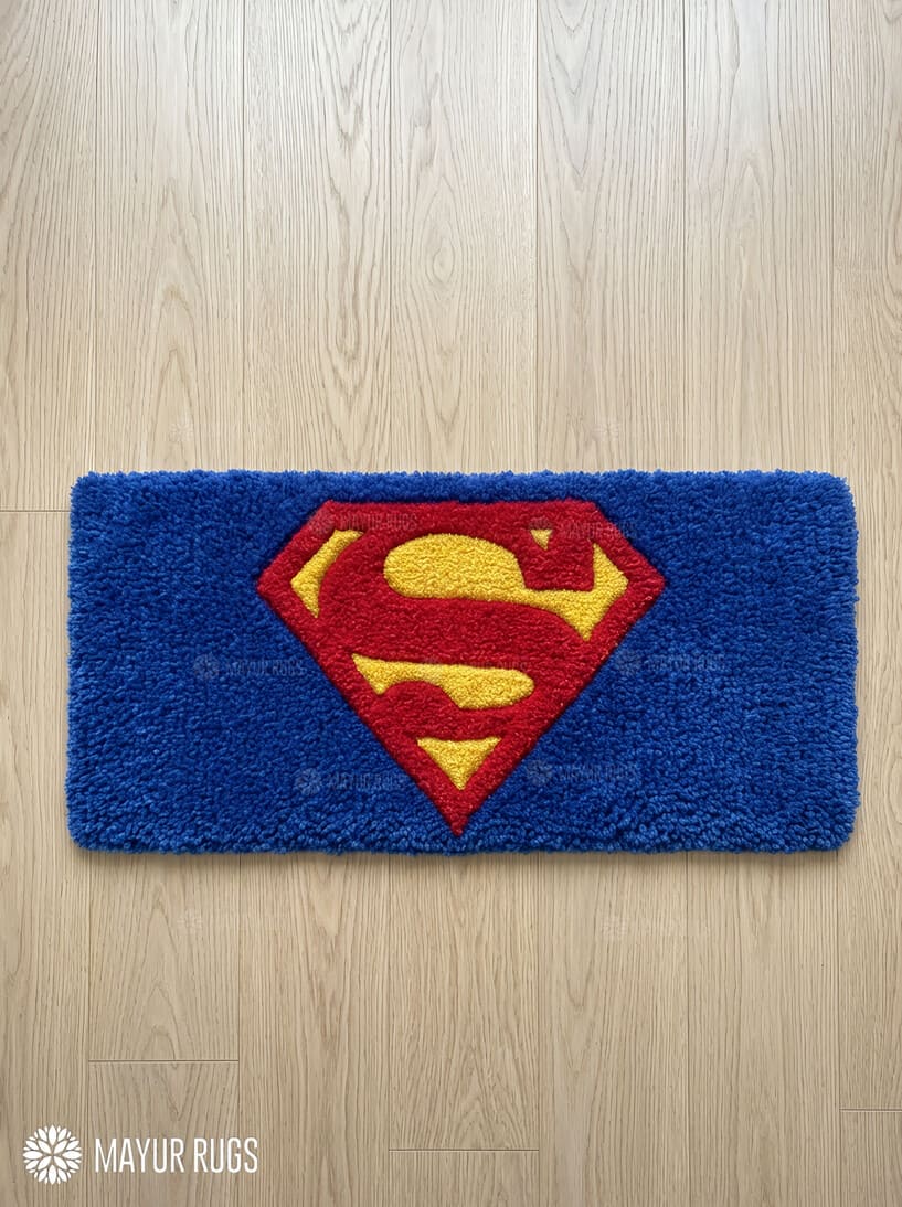Superman inspired hand-tufted keyboard rug with superhero gaming aesthetic by Mayur Rugs