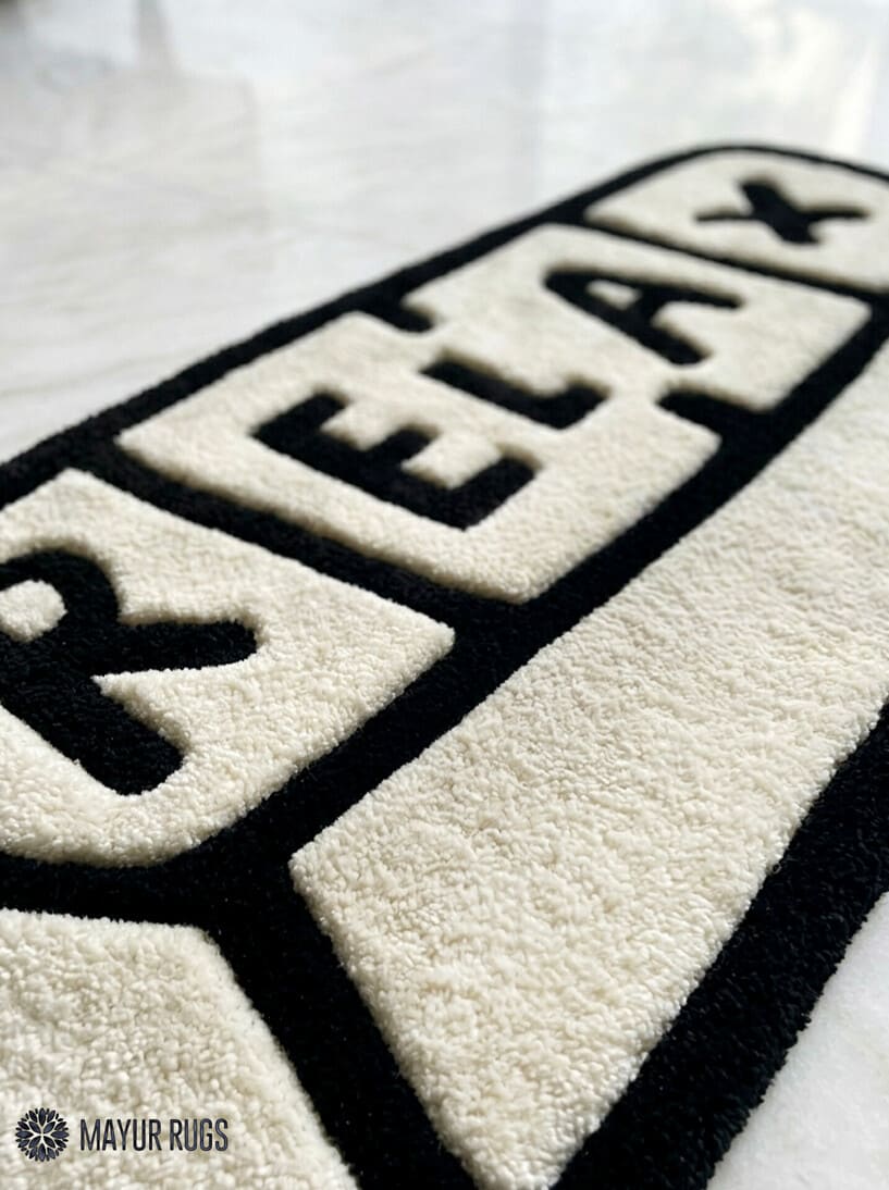 Relax pill-inspired hand-tufted wool rug with modern chill aesthetic and plush texture by Mayur Rugs
