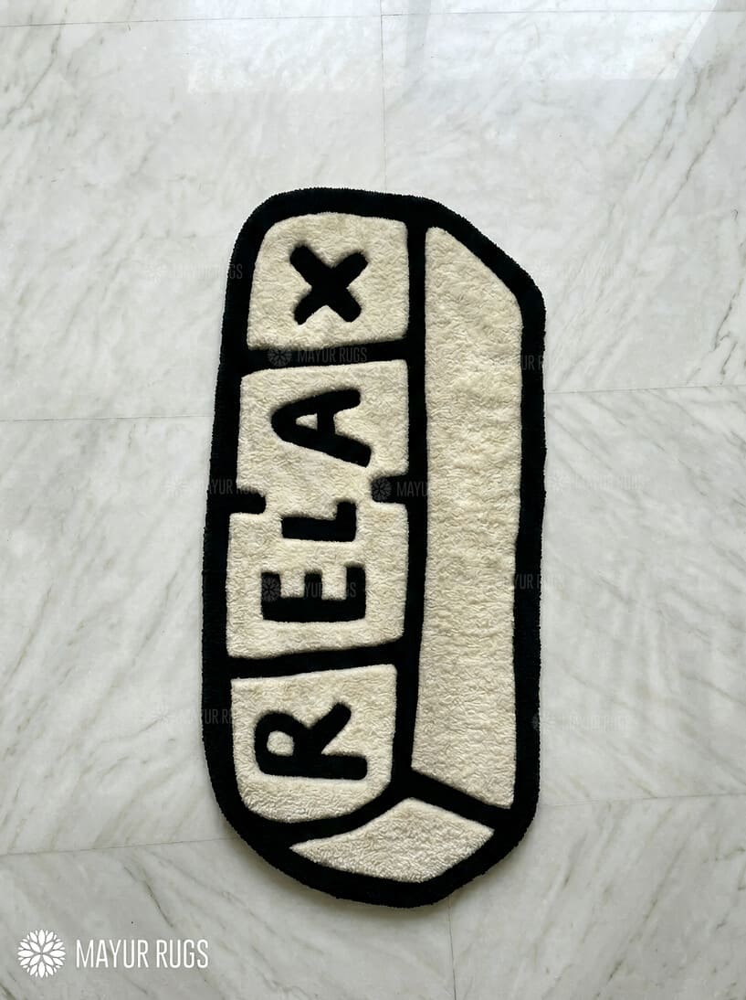 Relax pill-inspired hand-tufted wool rug with modern chill aesthetic and plush texture by Mayur Rugs