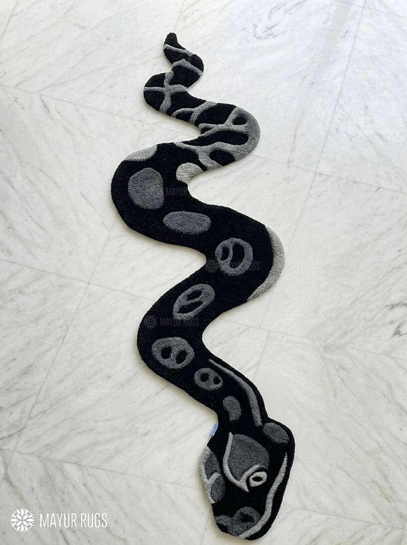 Black serpent hand tufted wool rug featuring snake shaped statement artwork by Mayur Rugs