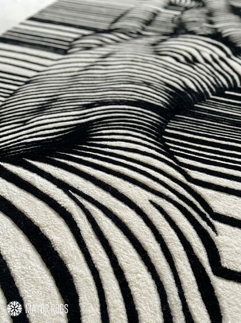 Abstract human illusion hand tufted wool rug featuring black and white optical art contour line design by Mayur Rugs