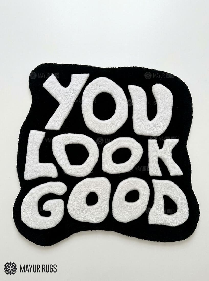 You Look Good typography hand-tufted wool rug with bold black and white affirmation design by Mayur Rugs
