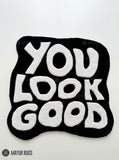 You Look Good typography hand-tufted wool rug with bold black and white affirmation design by Mayur Rugs