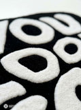 You Look Good typography hand-tufted wool rug with bold black and white affirmation design by Mayur Rugs