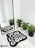 You Look Good typography hand-tufted wool rug with bold black and white affirmation design by Mayur Rugs