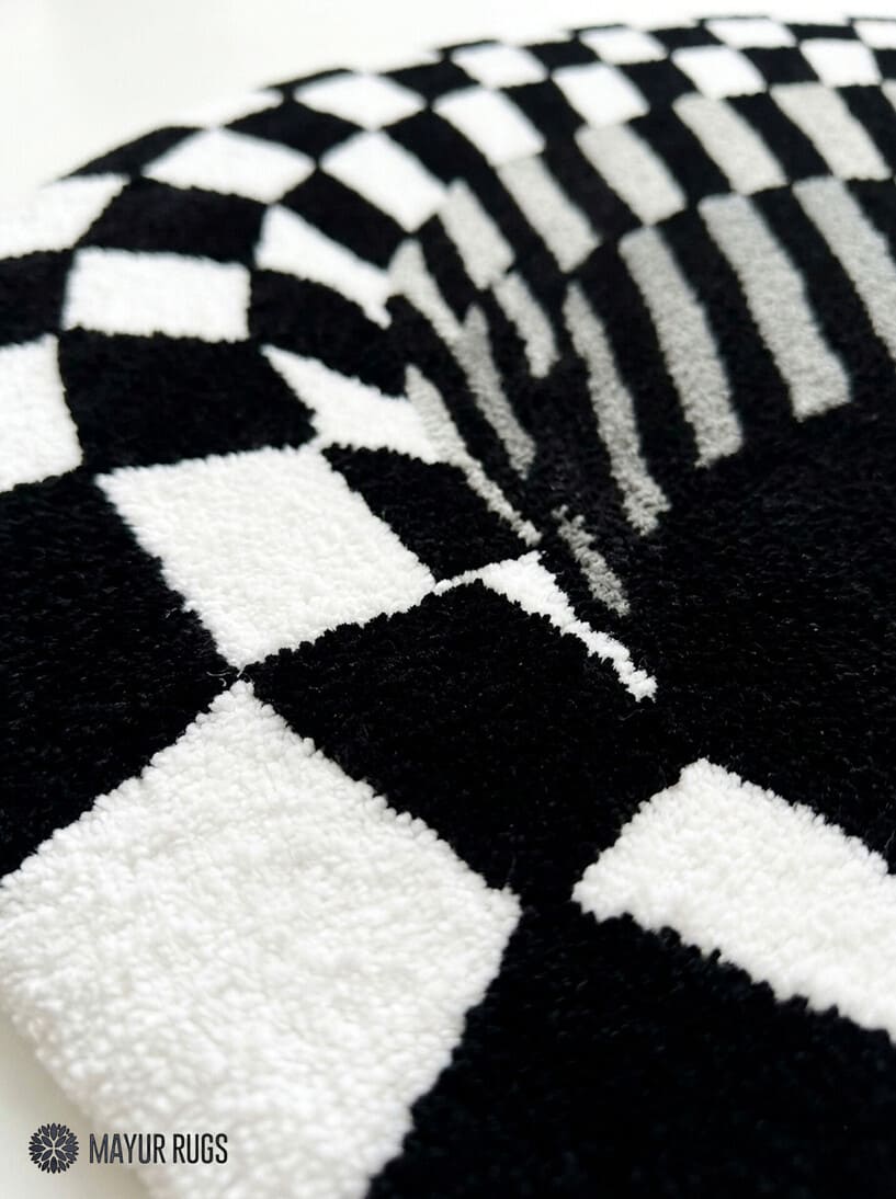 Handtufted black and white optical illusion vortex wool rug with checkerboard geometric design by Mayur Rugs