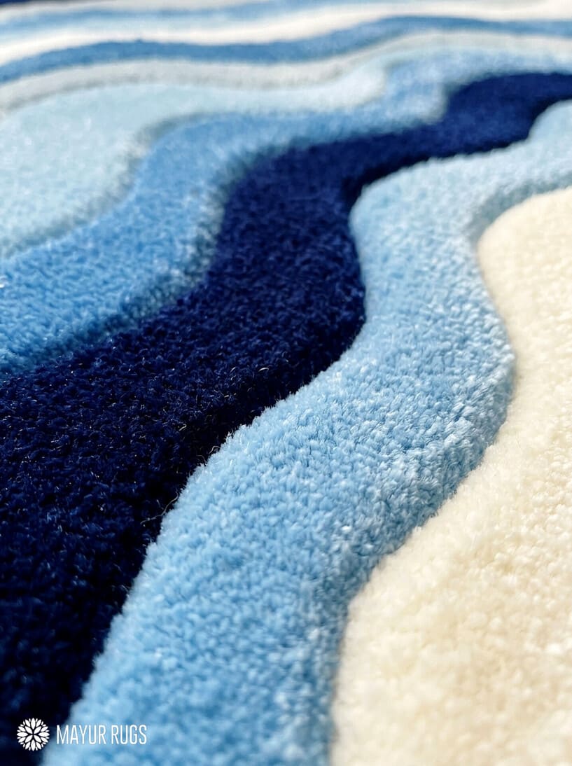 Ocean Wave 3D fluffy hand-tufted wool rug featuring abstract coastal wave artwork with sculpted cut-and-loop texture by Mayur Rugs.