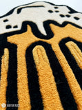 Beer stein hand tufted wool rug featuring overflowing foam and pub inspired artwork by Mayur Rugs