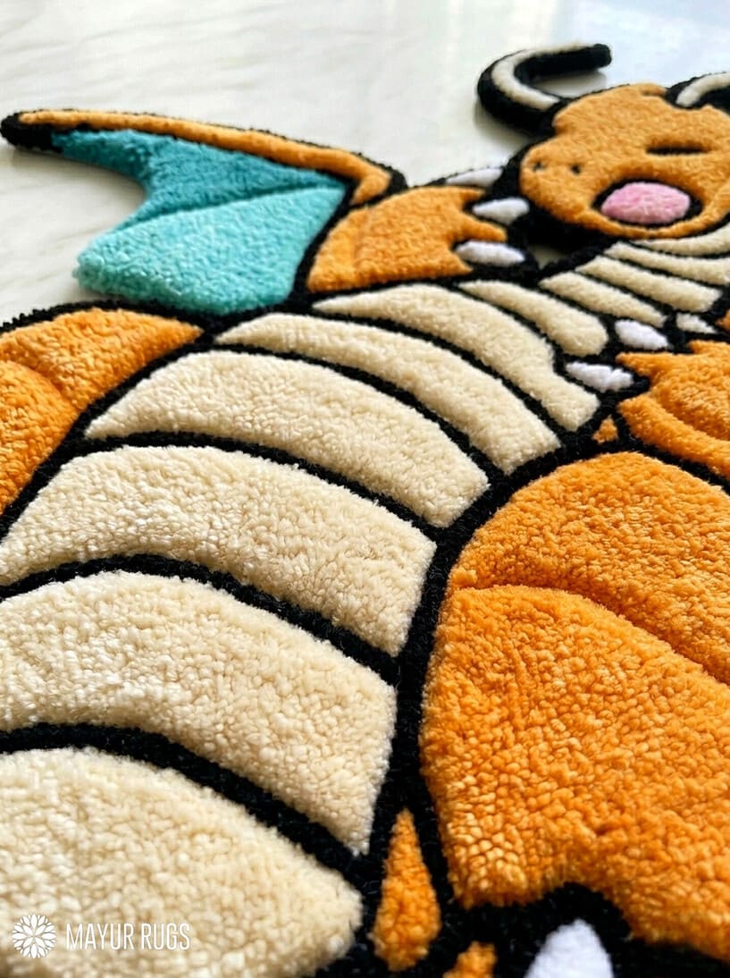 Pokemon Dragonite inspired hand tufted area rug with orange dragon character design handmade by Mayur Rugs