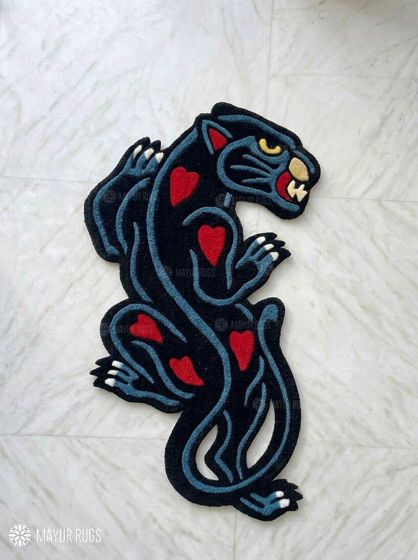 Black Panther tattoo style hand tufted area rug with red heart details handmade by Mayur Rugs