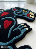 Black Panther tattoo style hand tufted area rug with red heart details handmade by Mayur Rugs
