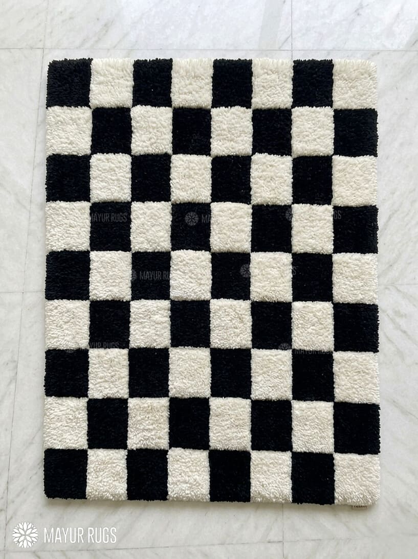 Black and white checkerboard hand tufted wool area rug featuring a classic geometric checkered pattern by Mayur Rugs.